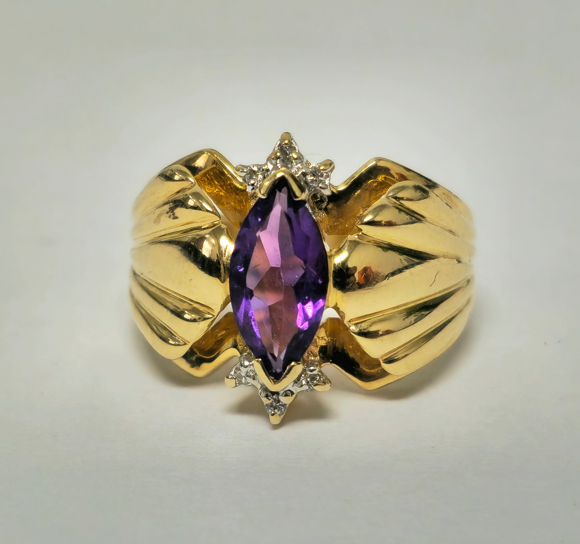 Victorian style 2.30 carat amethyst and diamond cocktail ring in 14k gold with intricate vintage detailing.