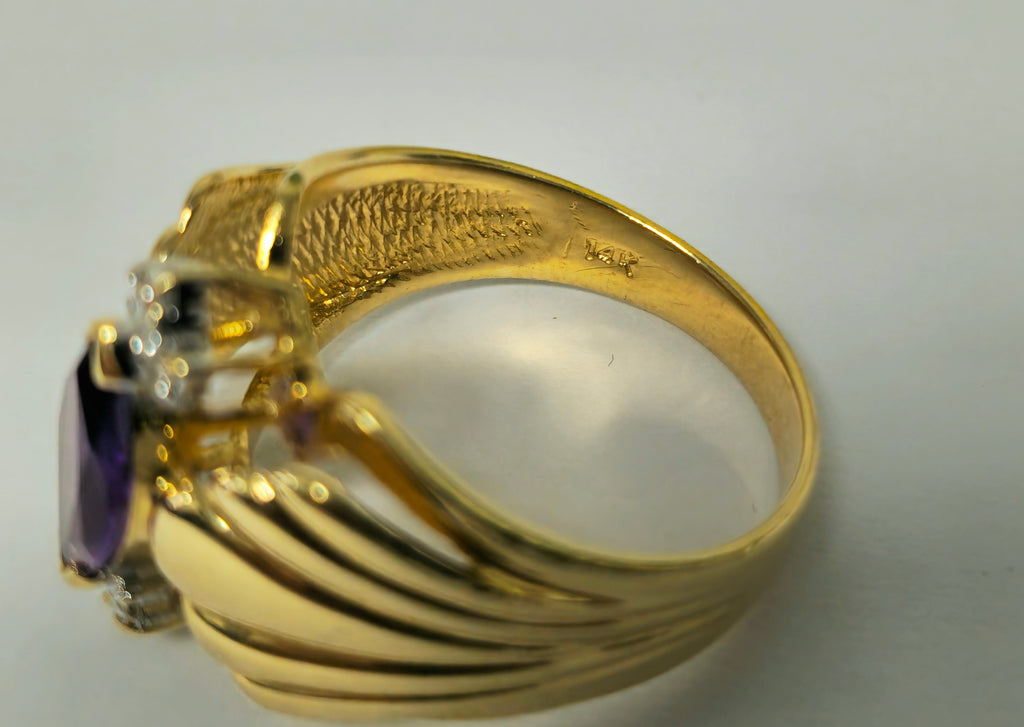 Victorian style 2.30 carat amethyst and diamond cocktail ring in 14k gold with intricate detailing.