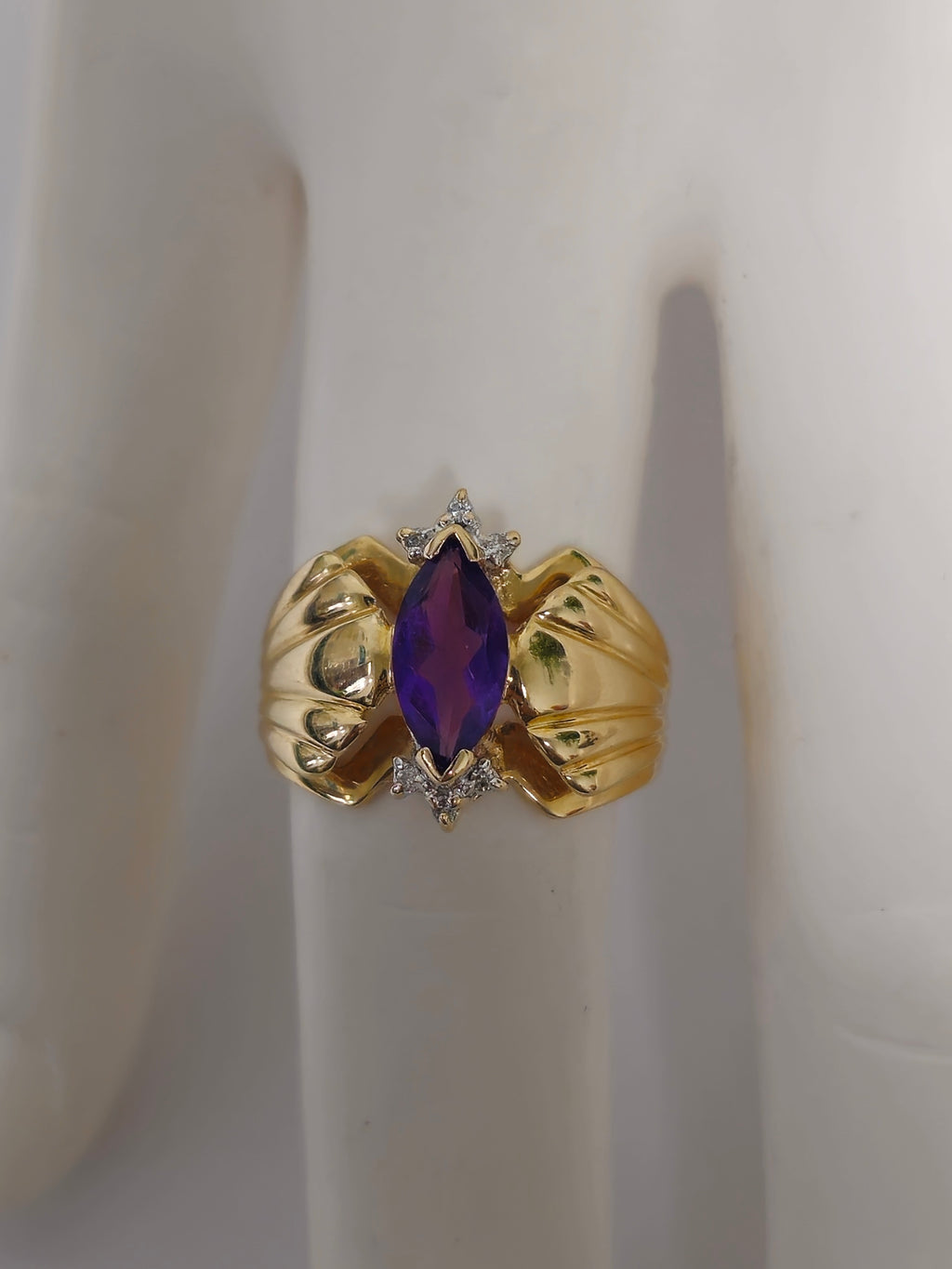 Victorian style 2.30 carat amethyst and diamond cocktail ring in 14k gold with intricate band design.