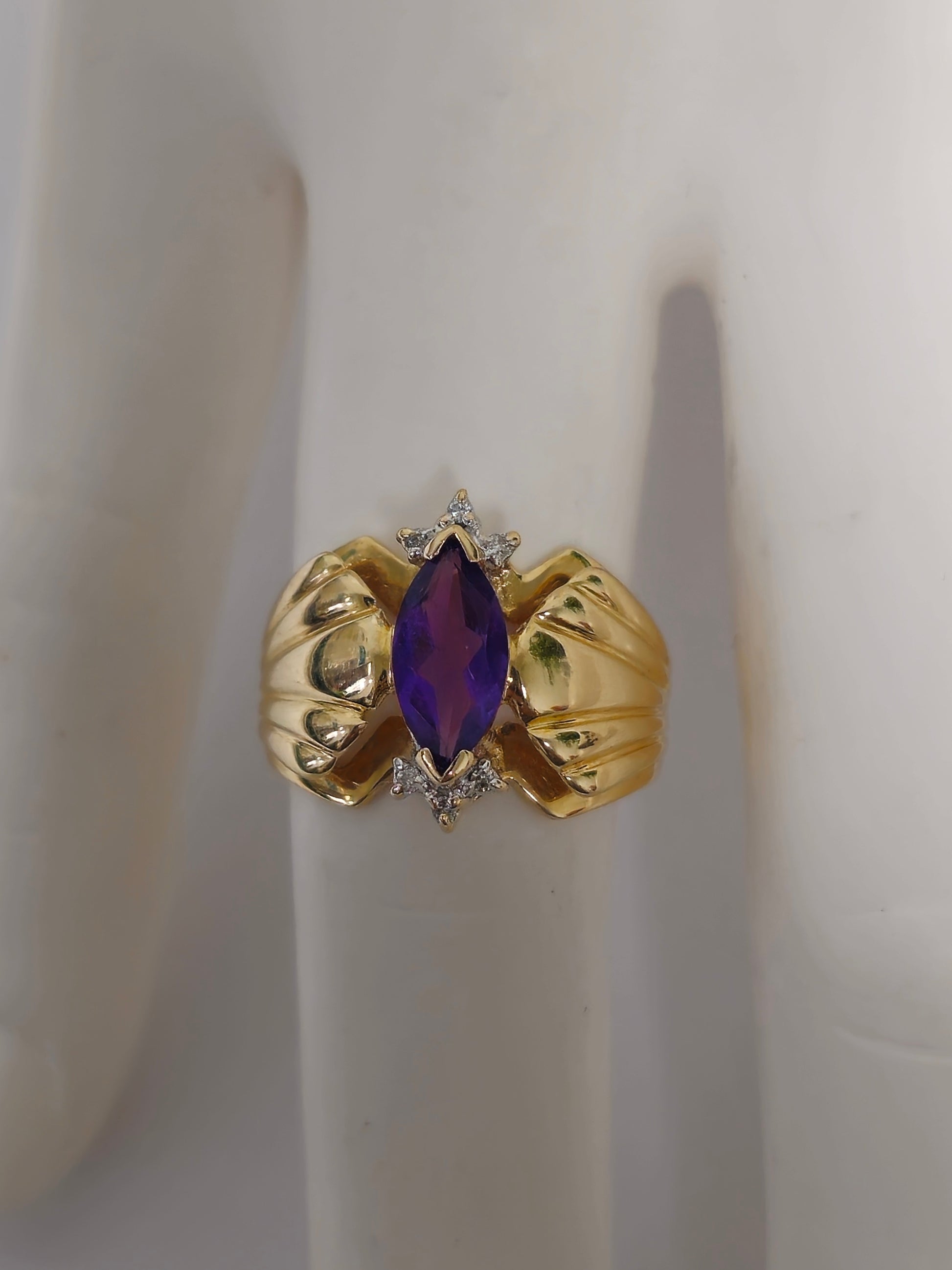 Victorian style 2.30 carat amethyst and diamond cocktail ring in 14k gold with intricate band design.