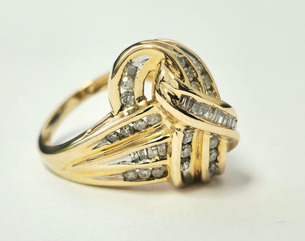 Art Deco women's diamond engagement ring featuring 2.10 carats in 14k yellow gold with intricate design details.