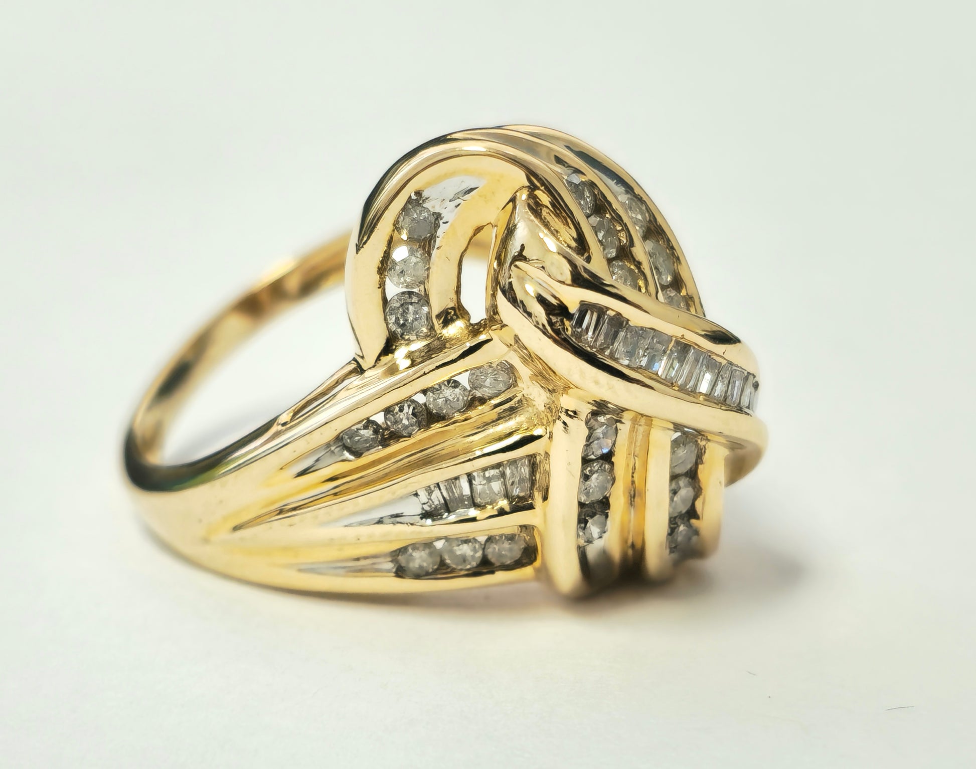 Art Deco women's diamond engagement ring featuring 2.10 carats in 14k yellow gold with intricate design details.