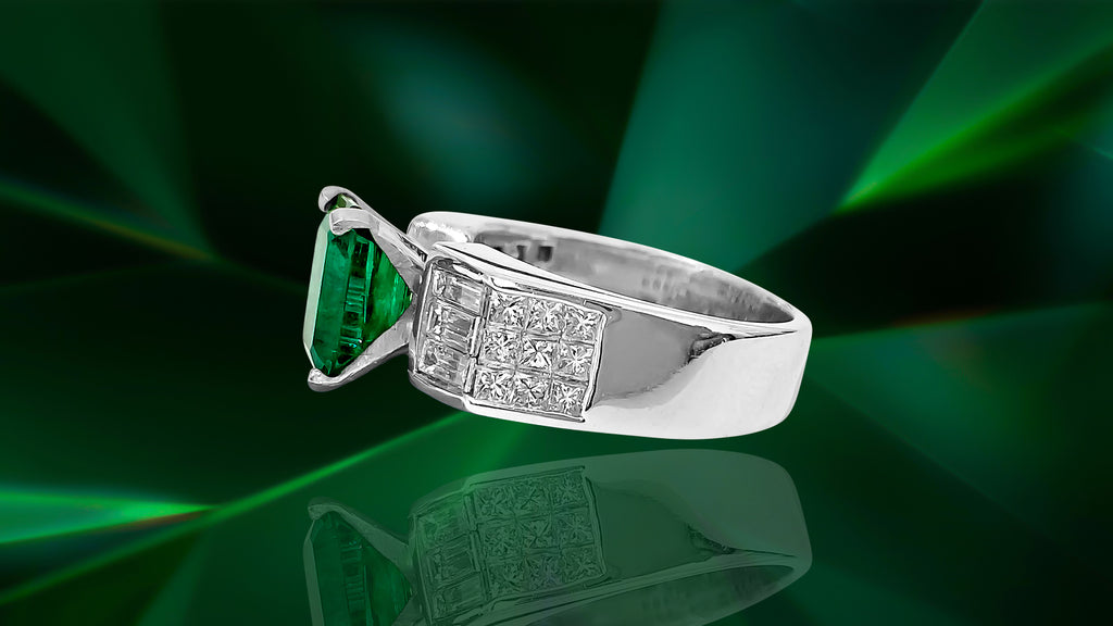 Vintage Prince The Jeweler 2.50ct natural emerald and diamond ring showing intricate gold band and vibrant green gemstone centerpiece.