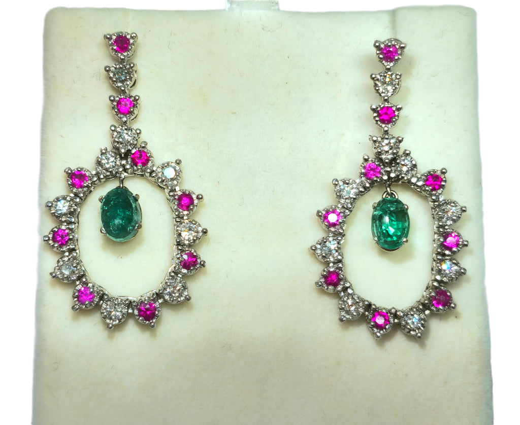 Elegant cocktail earrings featuring emerald, diamond, and ruby dangles from Prince The Jeweler showcasing sparkling gemstones.