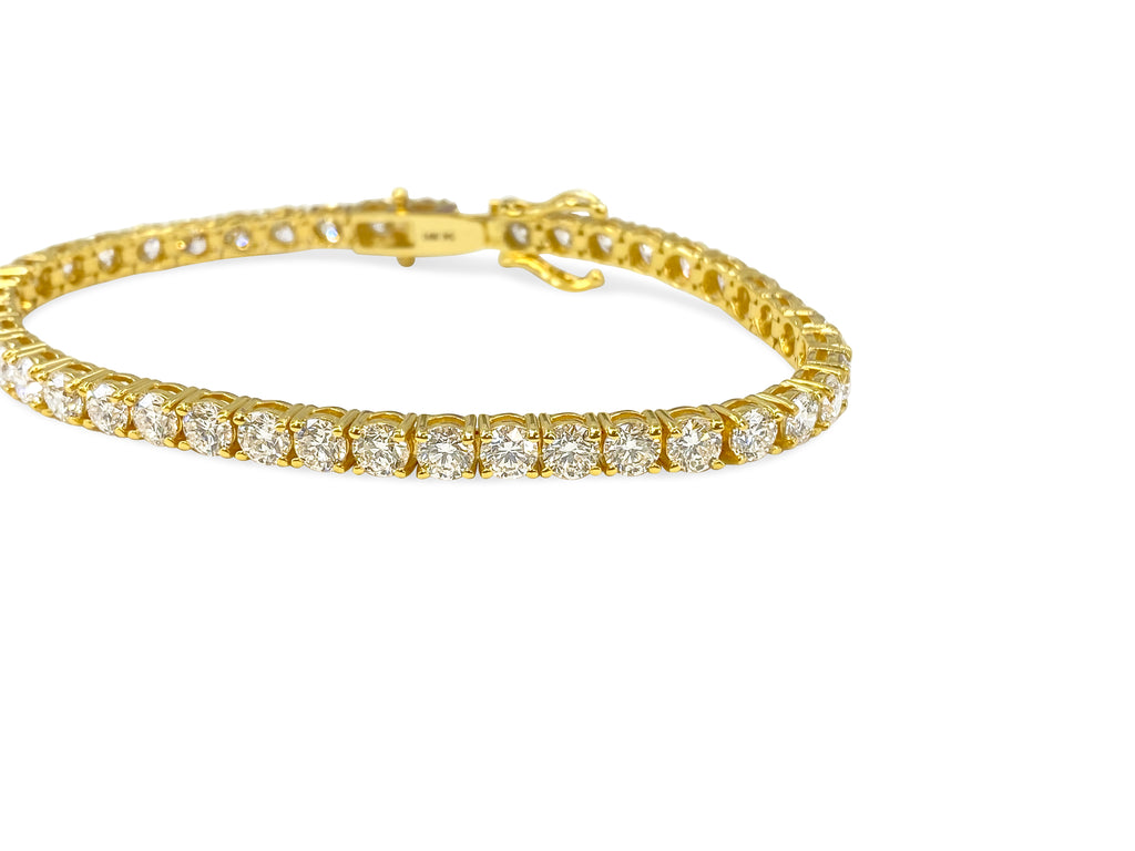 VVS diamond tennis bracelet in 10.50 carats, set in 14k gold, featuring sparkling diamonds and elegant design by Prince The Jeweler.