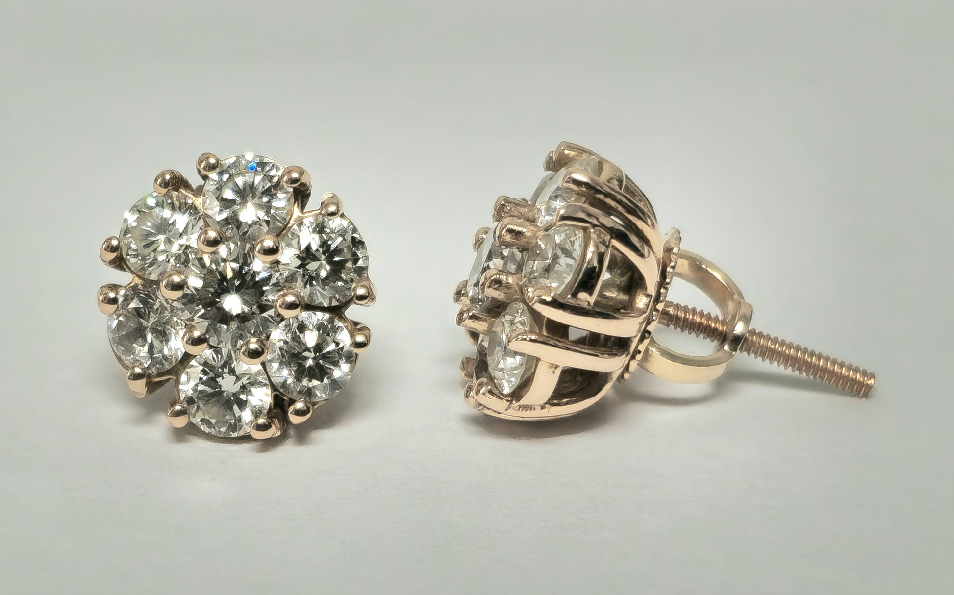 Elegant 2.50 carat VVS diamond cluster stud earrings in 14k rose gold with a modern design, by Prince The Jeweler.
