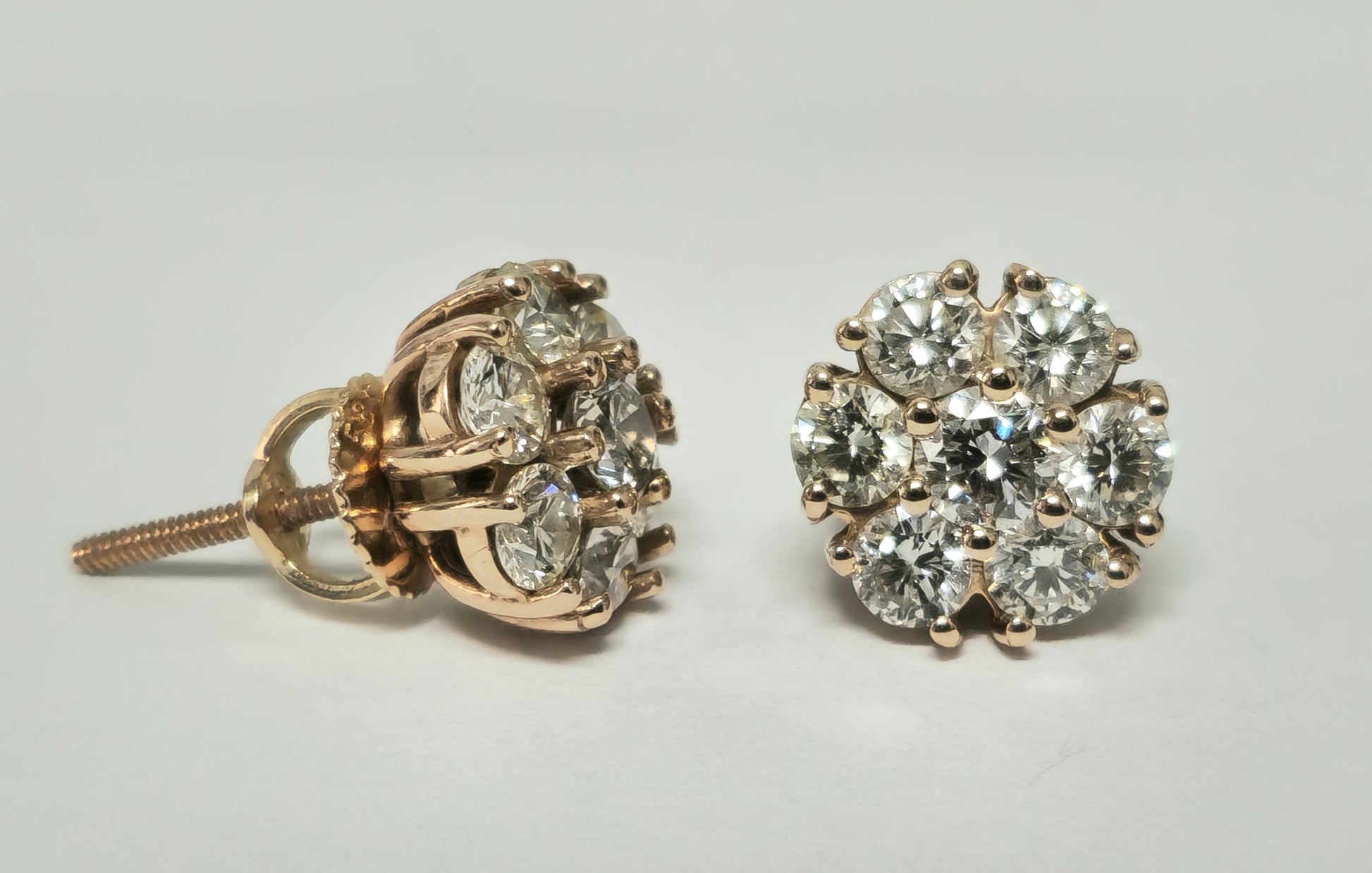 Modern 2.50 carat VVS diamond cluster stud earrings in 14k rose gold featuring sparkling diamond details.
