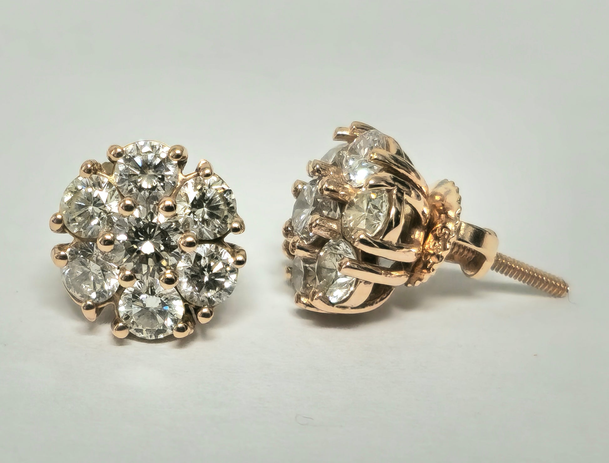 Modern 2.50 carat VVS diamond cluster stud earrings in 14k rose gold featuring sparkling diamond details.
